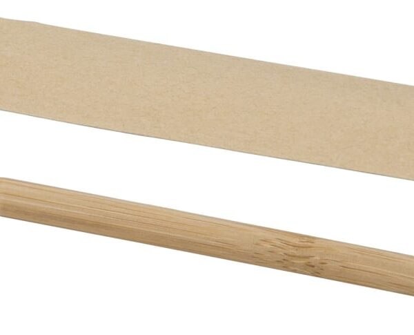 A wooden pencil with a black tip and a black cap lies on a white surface. Beside the pencil is a brown, rectangular paper sleeve with an open end.
