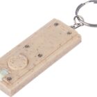 Beige keychain flashlight with metal ring and visible screws.