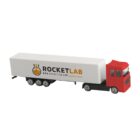 Red toy truck with a Rocket Lab logo and website on the white trailer.