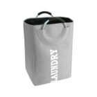 Gray laundry basket with LAUNDRY text and circular handles.