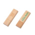 Two wooden USB drives, one with engraved text, the other with printed logos.