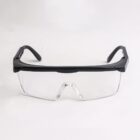 Black and clear safety glasses on a white background.