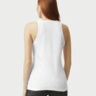 Person in white sleeveless top and jeans, facing away.