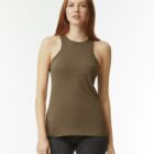Person in a brown sleeveless top and jeans against a white background.