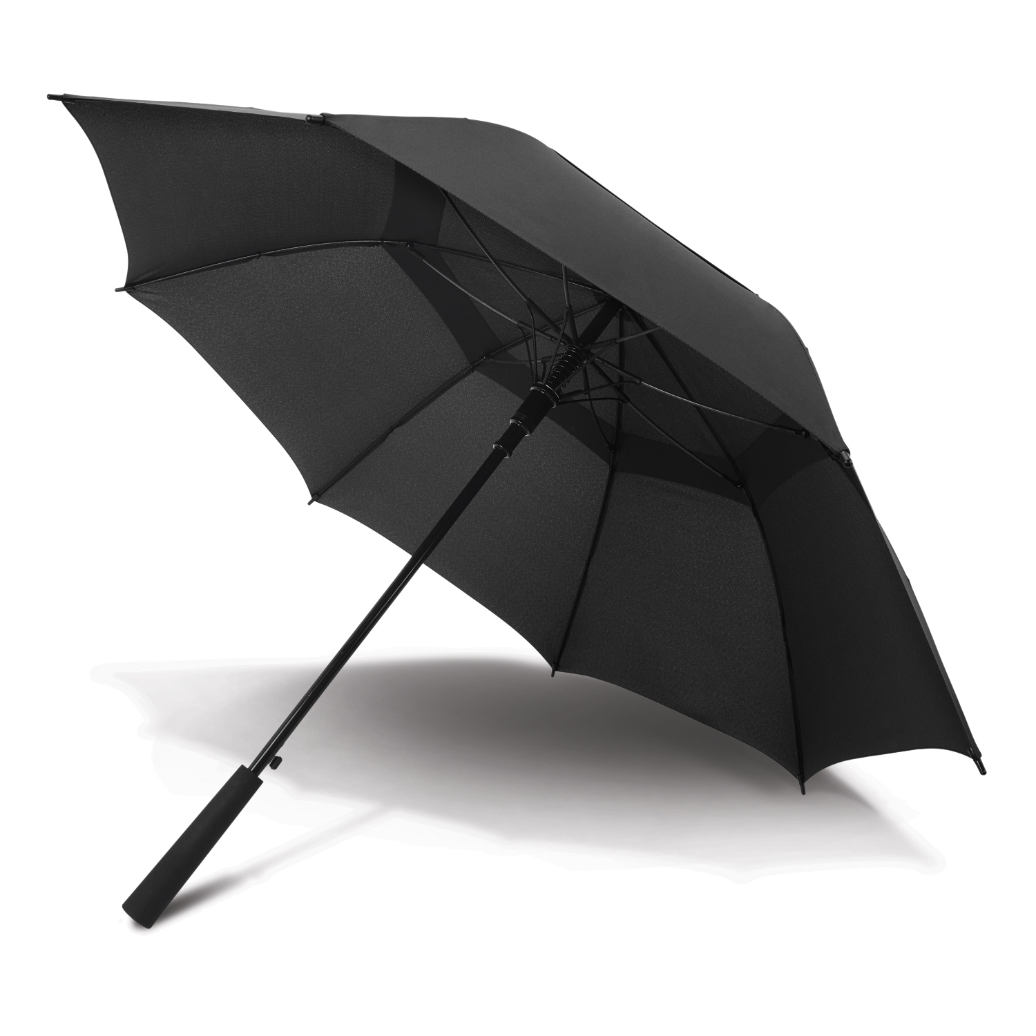 Black umbrella open on the ground, casting a shadow; an outdoor elegance essential.