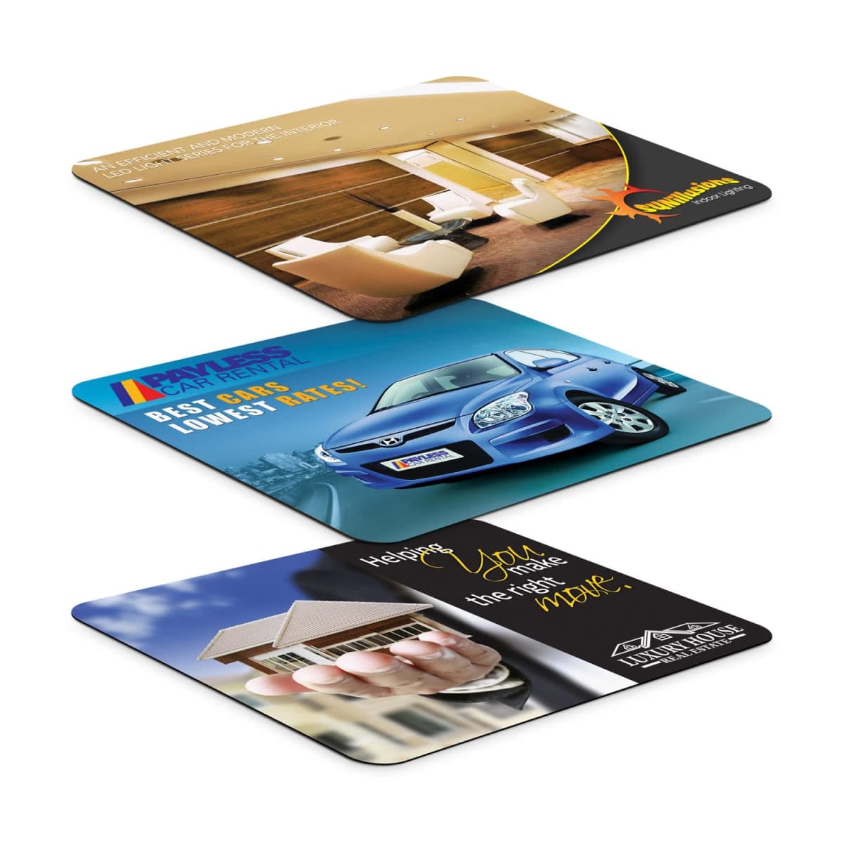 Three rectangular mouse pads in perspective view. Top pad depicts a modern office lounge; middle pad features a blue car; bottom pad shows a hand holding a small house model. Each pad has colorful branding and text.