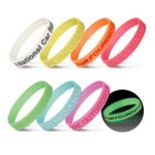Seven colorful wristbands, one glows in the dark.