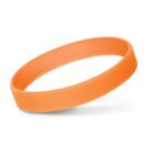 Orange silicone wristband against a white background, casting a soft shadow.