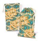 Two fabric bags with a retro pattern in turquoise, blue, and orange. The text WINE & DINE is printed in bold letters. The bags have drawstring closures and are displayed upright.