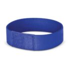 A blue fabric wristband lies flat on a white background. It has a rectangular patch for securing the band.