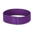 A purple fabric wristband with a rectangular velcro closure. The band is circular in shape and appears to be made of a smooth, textured material.