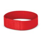 A red fabric wristband with a Velcro fastening, shown against a white background. The band is circular and the material appears to be soft.