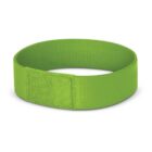 A green fabric wristband with a rectangular patch.