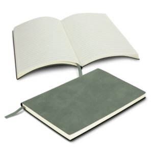 Two green diaries, one open with lined pages and one closed, featuring ribbon bookmarks.