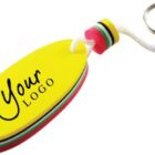 Yellow surfboard-shaped keychain with Your Logo text and colorful layers.