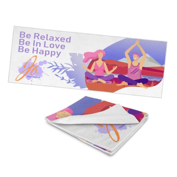 Illustrated yoga mat showing two people meditating outdoors against a colorful landscape. Text reads, Be Relaxed, Be In Love, Be Happy. Nearby is a folded view of the same mat.