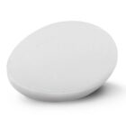 A white, oval-shaped, flat pod resting on a plain surface. The pod has a textured fabric covering, giving it a sleek and minimalistic design.