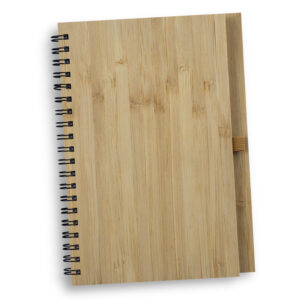 A bamboo cover spiral diary with a pen attached to the side.