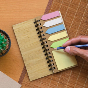 Notebook with FSC certified sticky notes on table