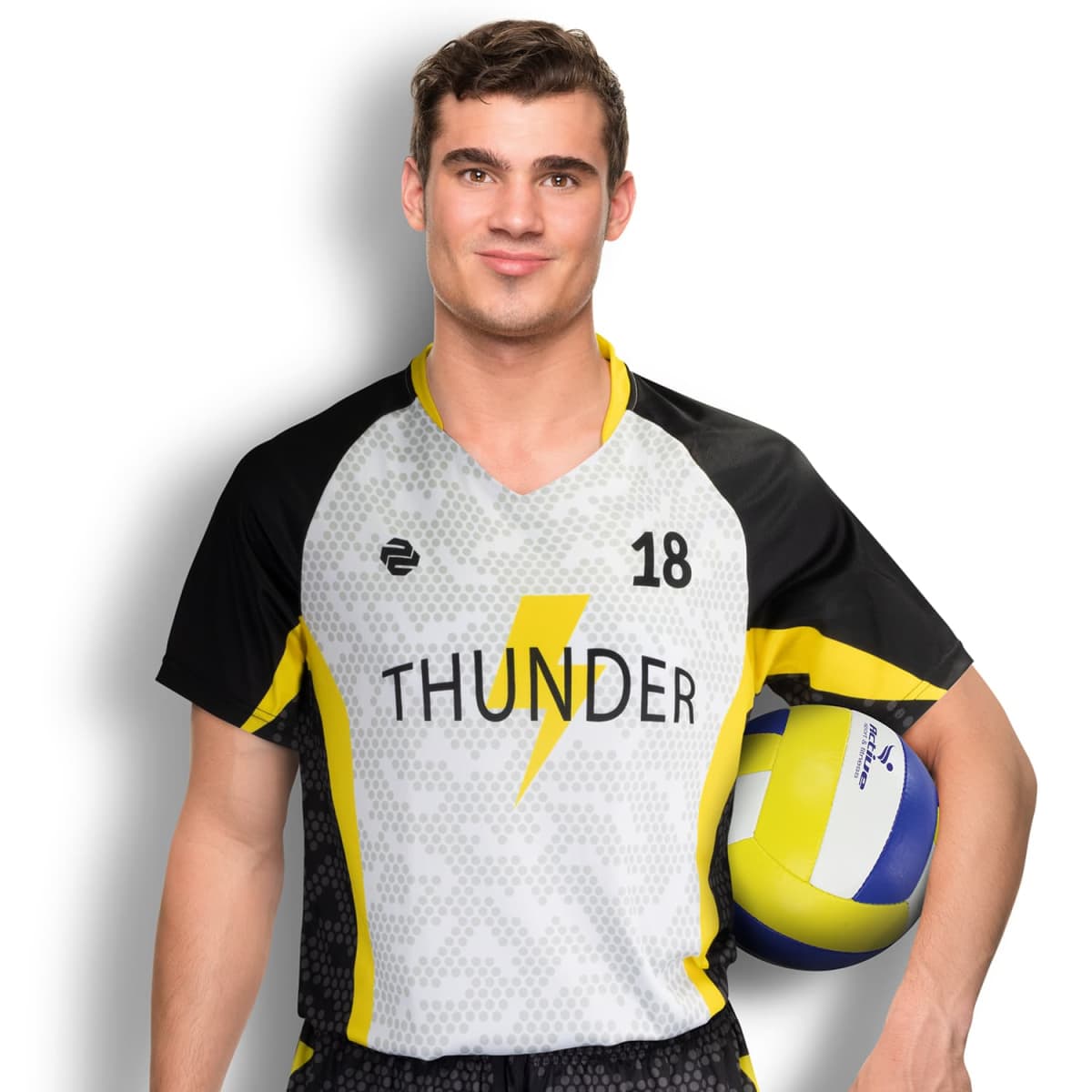 A man in a volleyball jersey with THUNDER and the number 18 stands smiling, holding a volleyball under his arm. The jersey is white with black and yellow accents.