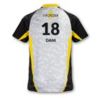 A sports jersey with black sleeves and a white and gray pixelated pattern on the back. It has the name DANI and the number 18 in bold black letters beneath THUNDER with a yellow lightning bolt above. Yellow accents line the sides.