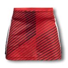 A red skirt with black diagonal stripes and white side panels, creating a dynamic pattern. The design gives a modern and sporty appearance. The skirt has a straight silhouette and smooth texture.