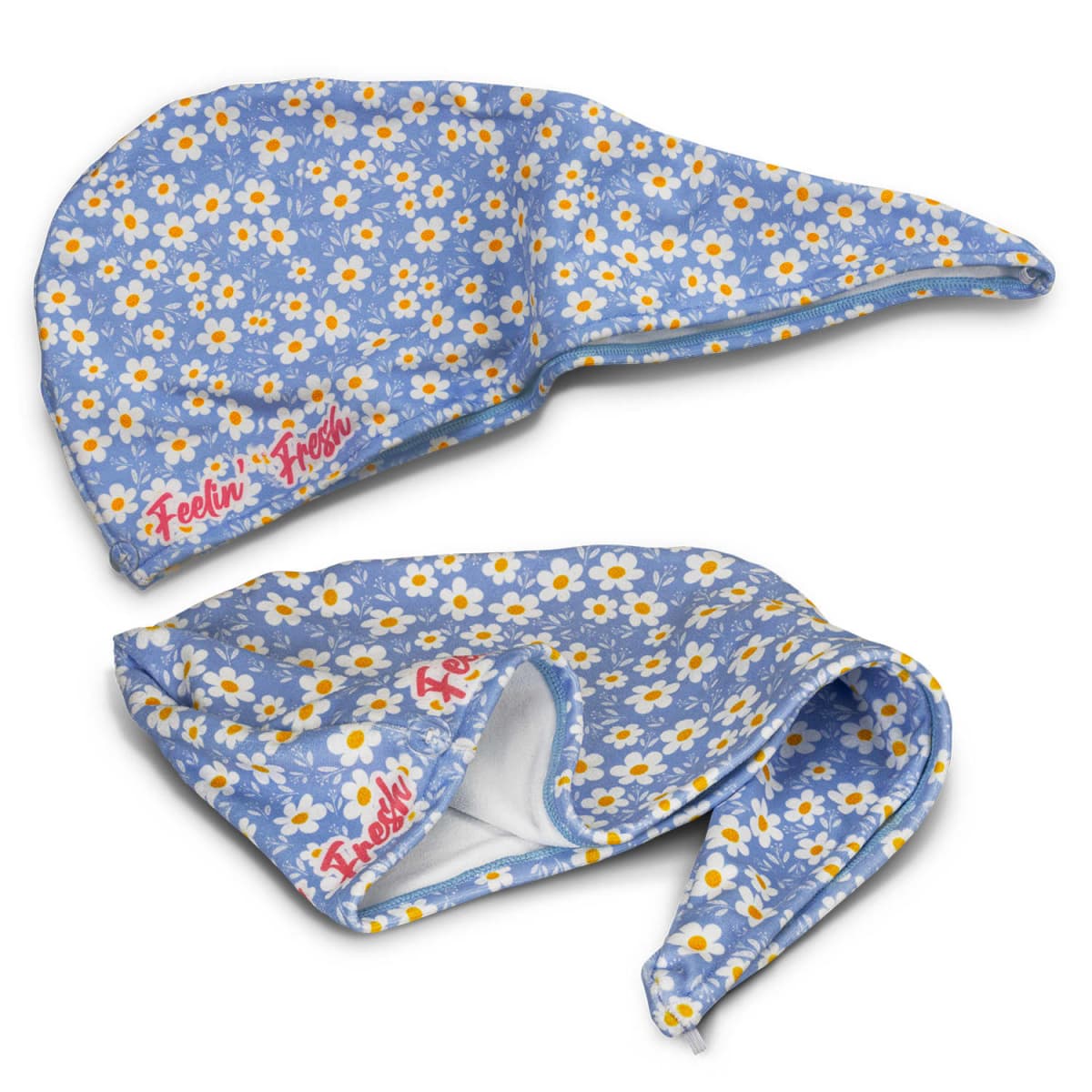 Two blue, floral-patterned scrub caps with white and yellow daisies. One cap is laid out flat, and the other is tilted, showing the inner lining. Both caps have Feelin Fresh embroidered in orange-red script on the side.