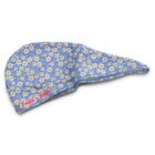 A blue scrub cap with a pattern of small yellow and white flowers. The words Feelin Fresh are embroidered in red on one side.