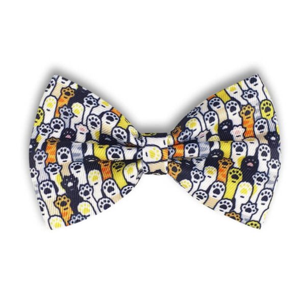 A bow tie featuring a pattern of small ghosts in yellow, orange, and white with black eyes, set against a dark background. The design gives a playful and spooky Halloween theme.