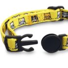 A vibrant yellow cat collar with black plastic buckle and adjustable strap. The collar features a playful pattern of cartoon cats in various poses, adding a whimsical touch.