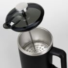 Black French press coffee maker with lid removed, viewed from above.