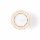 Wooden tea light candle holder with a candle, viewed from above.