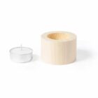 Wooden candle holder with a white tealight candle beside it.