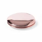 Shiny rose gold compact mirror on a white background.