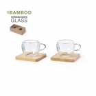 Two glass cups on square bamboo coasters with packaging box.