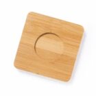 Square bamboo coaster with a circular groove in the center.