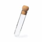 A glass test tube with a cork stopper, positioned at an angle on a white background.