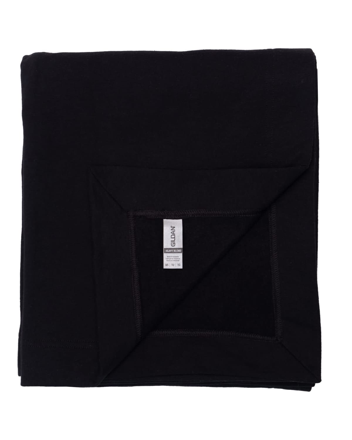 A folded black blanket with a visible care label on one corner.