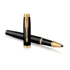 Black and gold pen with cap removed and placed next to the pen on a white background.
