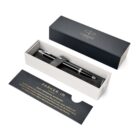 A black Parker pen in a gift box with an information card beside it.