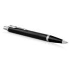 Black and silver retractable ballpoint pen on a white background.