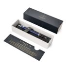 A blue Parker pen in an open gift box with a card describing the product.