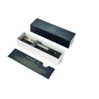 A Parker pen with gold trim in an open gift box, next to an informational card.