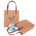 Two brown tote bags, one upright and one lying down with items spilling out.