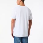 Man wearing a plain white T-shirt and blue jeans, facing away from the camera.