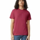 Person with long curly hair wearing a plain red t-shirt and blue jeans, standing facing forward.