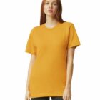 A woman in a yellow t-shirt and black pants stands facing forward against a white background.