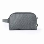 A gray fabric toiletry bag with a side handle and a small black label.