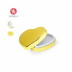 Gold heart-shaped tin open, with a white interior. Vanilla flavor icon in the corner.