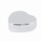 A small, shiny, silver heart-shaped box on a white background.